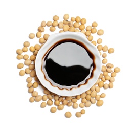 Bowl of soy sauce and beans on white background, top view