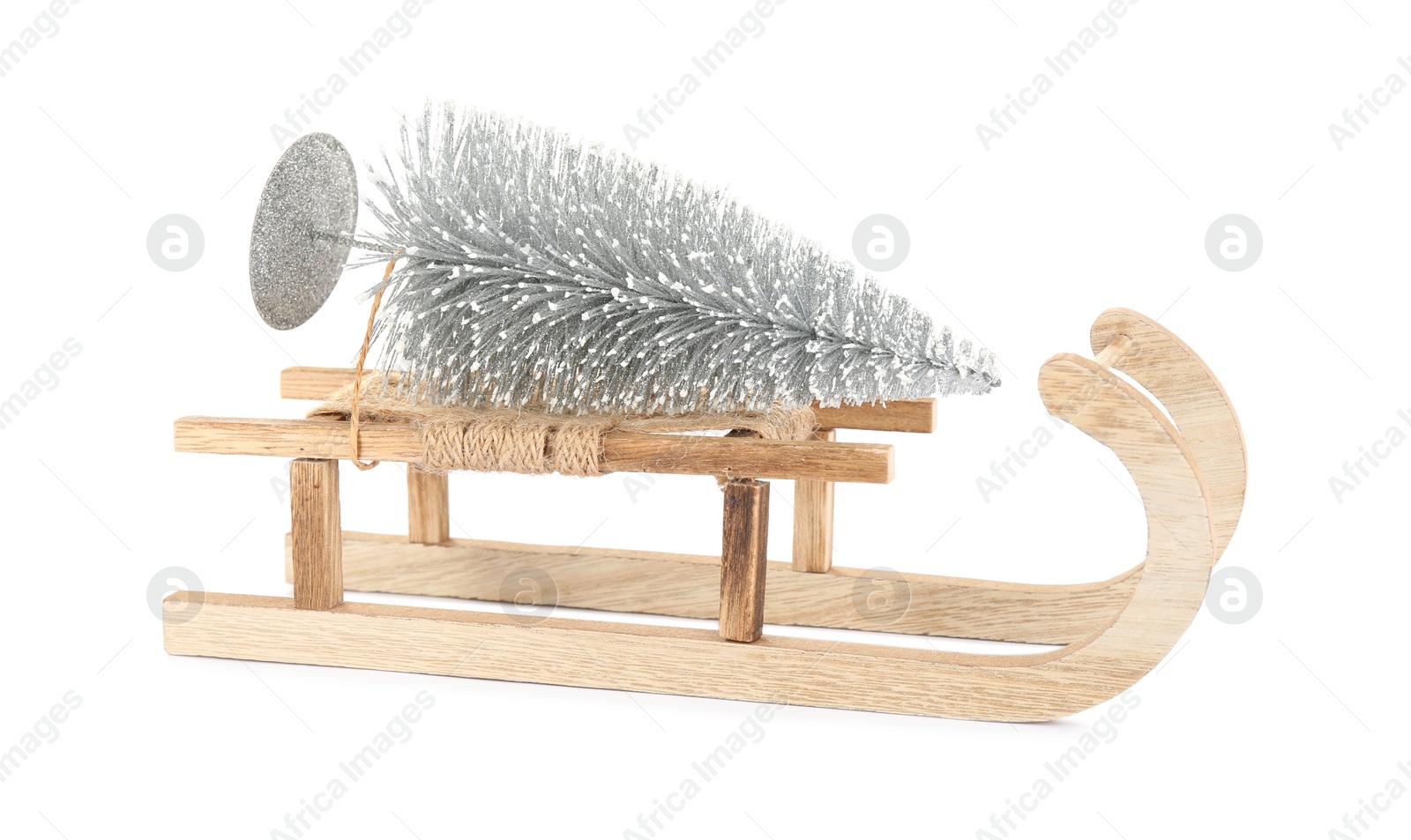 Photo of Wooden sleigh with decorative fir tree on white background. Christmas holidays