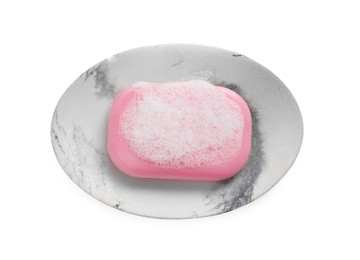 Photo of Soap bar with fluffy foam in holder on white background, top view
