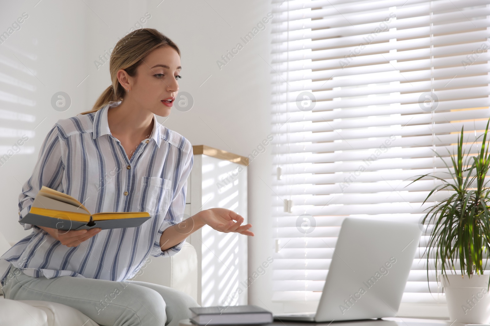 Photo of Teacher giving online school lesson. Distance learning during coronavirus quarantine, study at home