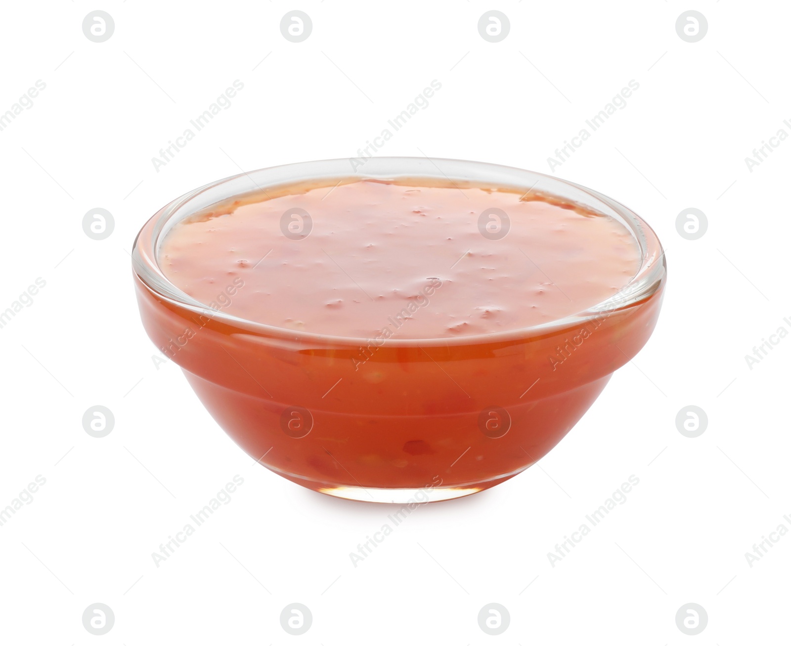 Photo of Tasty chili sauce in bowl isolated on white