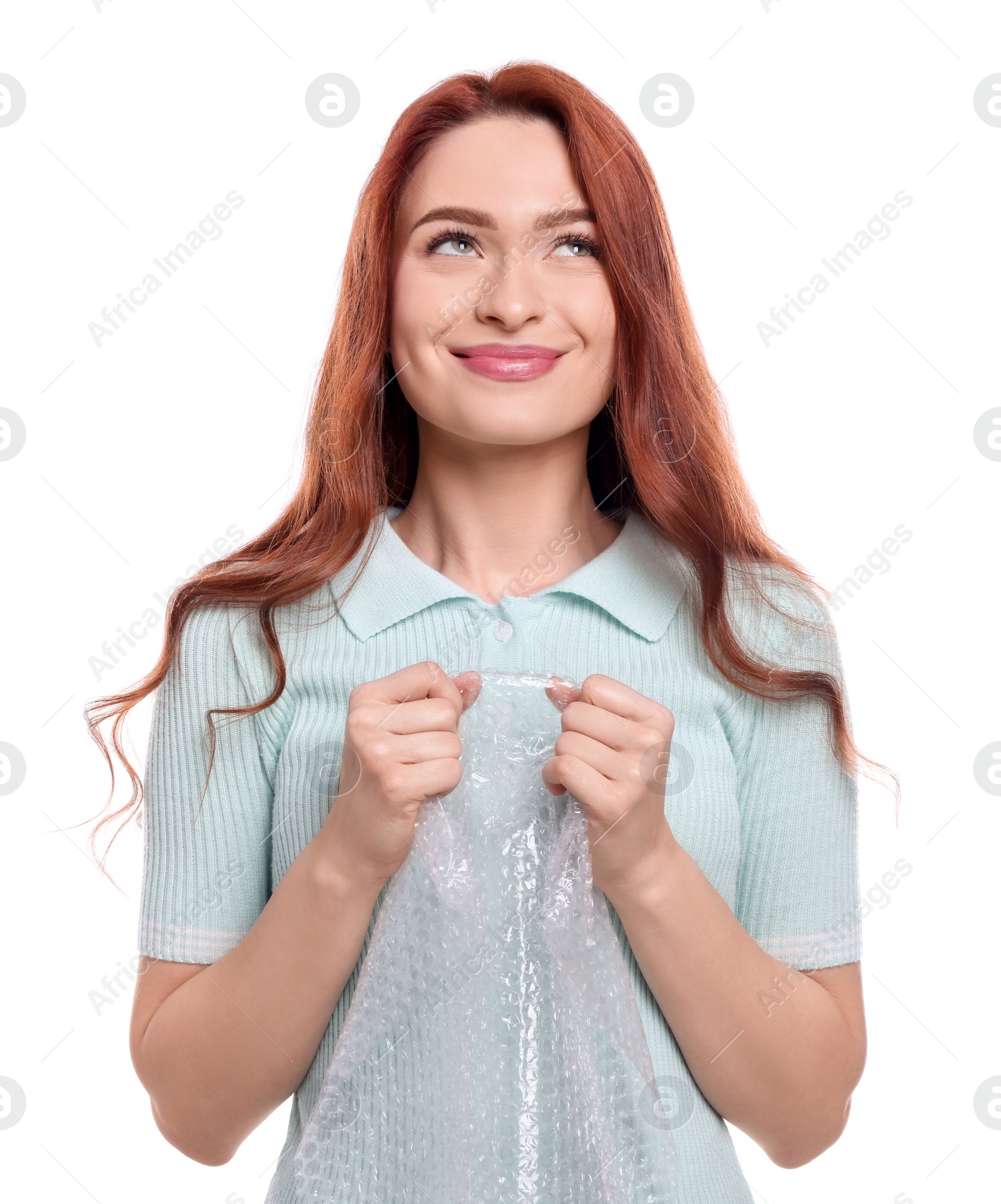 Photo of Woman popping bubble wrap on white background. Stress relief