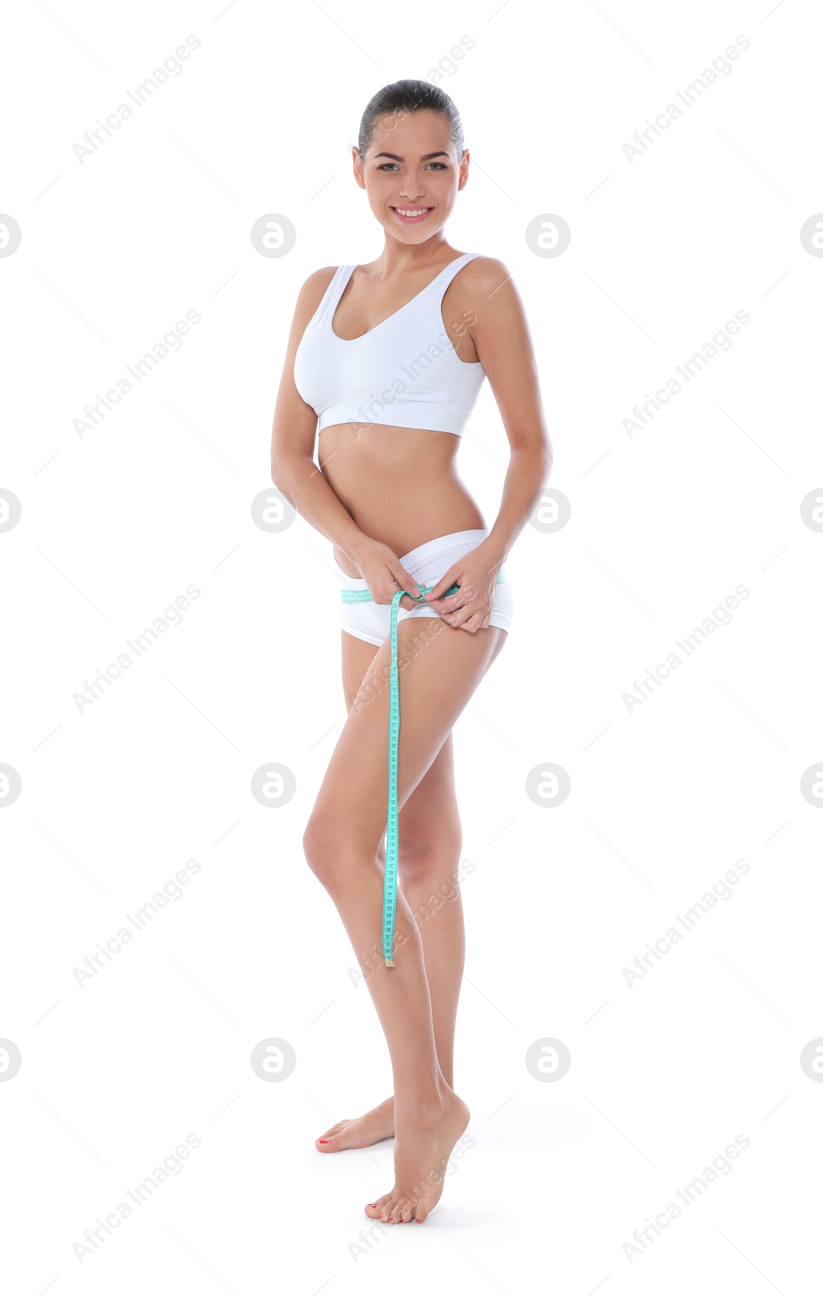 Photo of Slim woman measuring her hips on white background. Weight loss