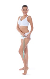 Photo of Slim woman measuring her hips on white background. Weight loss
