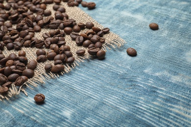 Coffee beans on wooden background