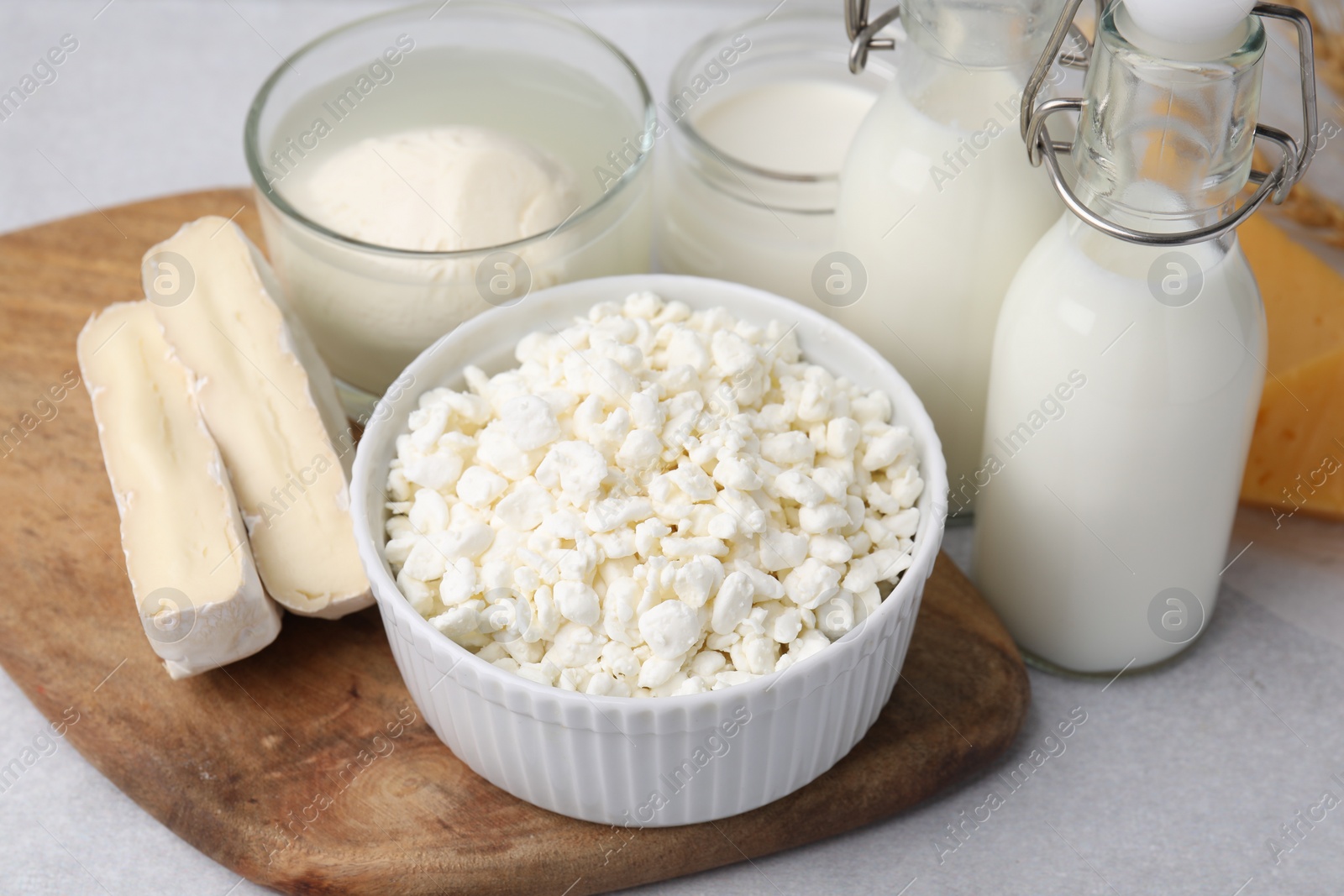 Photo of Different fresh dairy products on light table