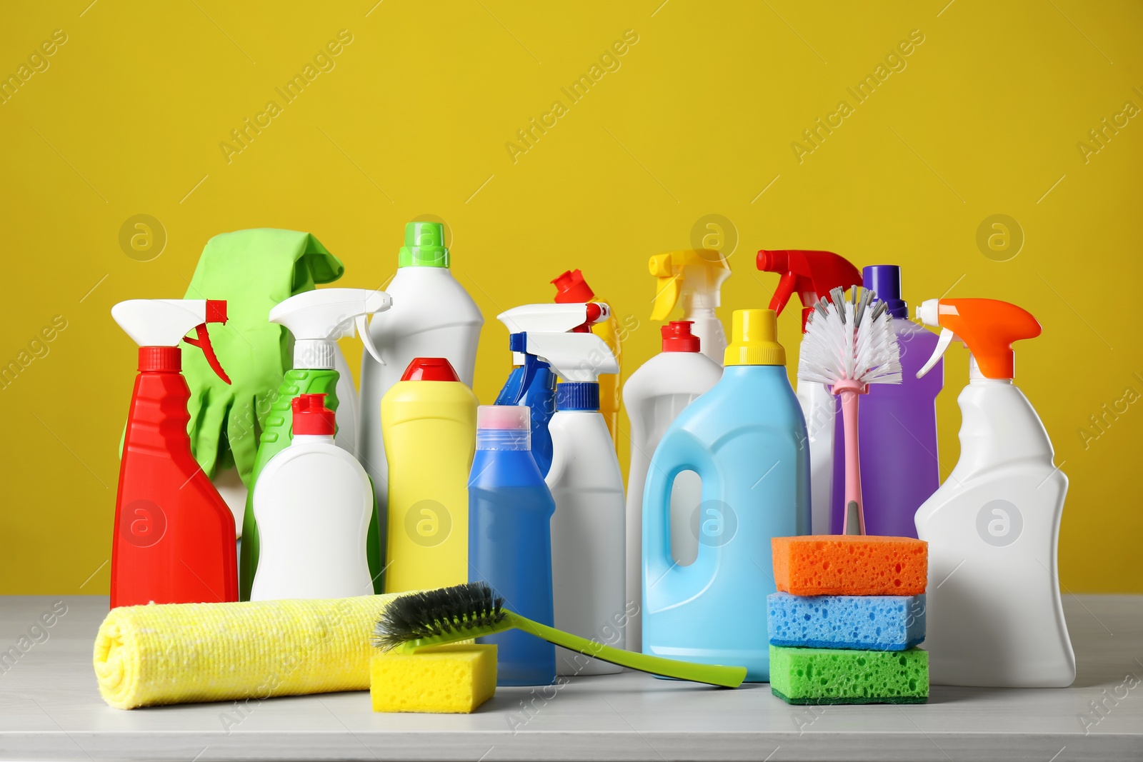 Photo of Different cleaning products and supplies on light table