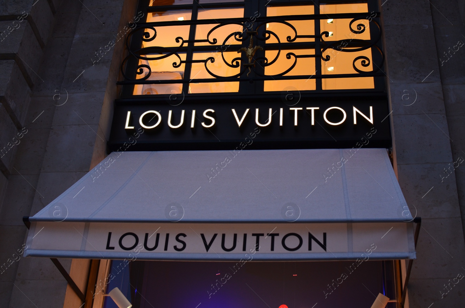 Photo of Paris, France - December 10, 2022: Louis Vuitton store exterior in evening