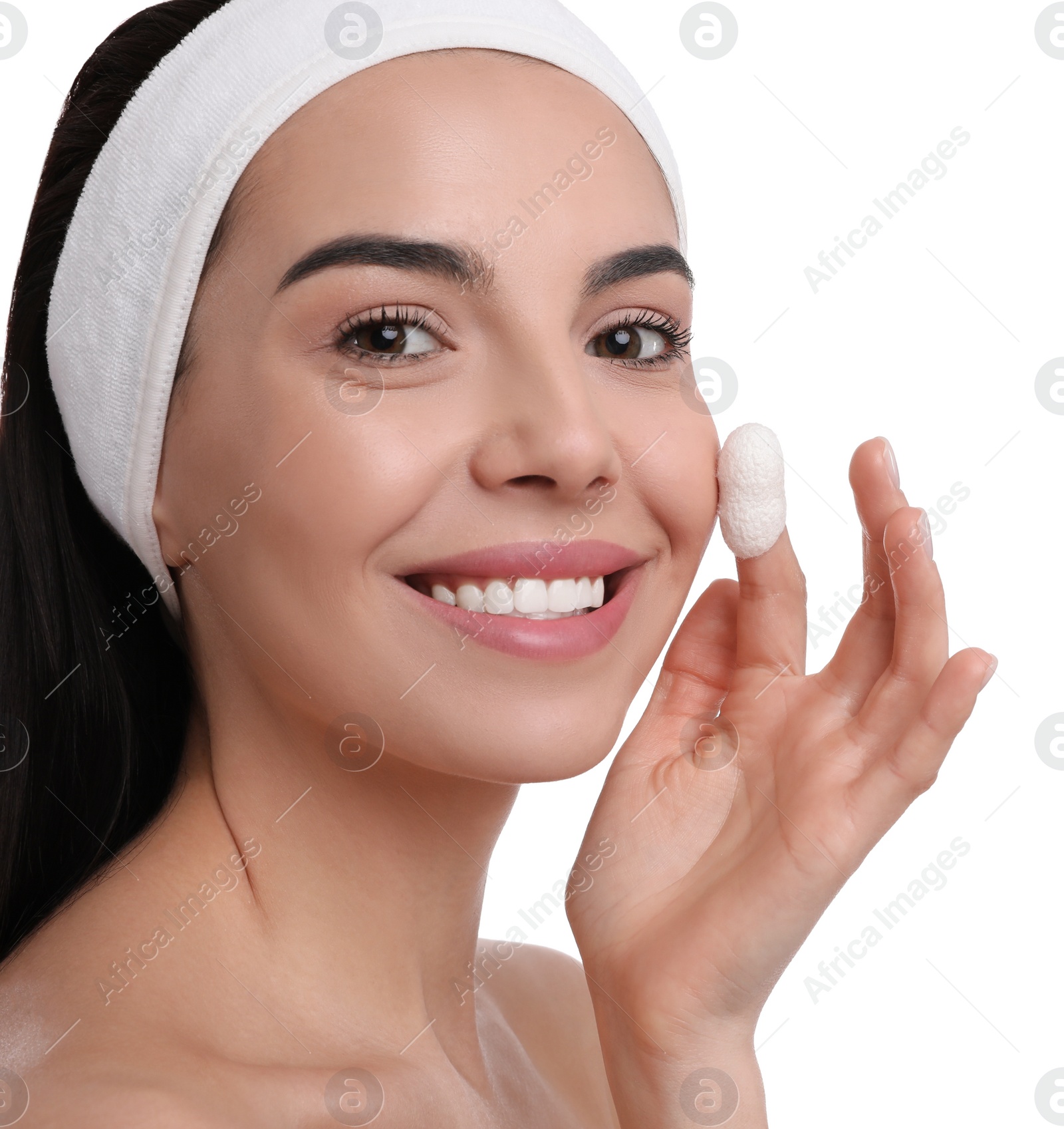Photo of Woman using silkworm cocoon in skin care routine on white background
