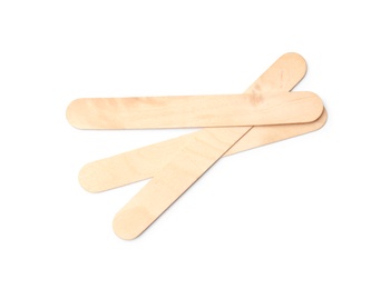 Empty wooden ice cream sticks on white background, top view