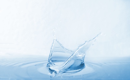 Splash of water with drops on white background, closeup