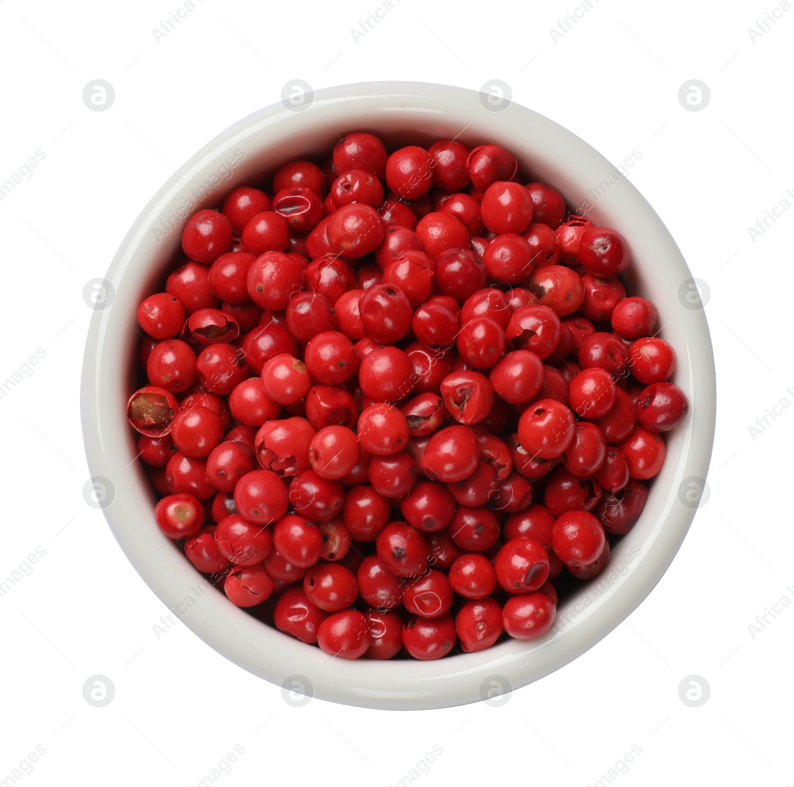 Photo of Aromatic spice. Red pepper in bowl isolated on white, top view