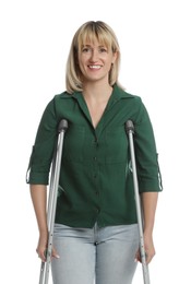 Photo of Portrait of happy woman with crutches on white background