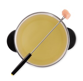 Oil in fondue pot and fork with piece of raw meat isolated on white, top view