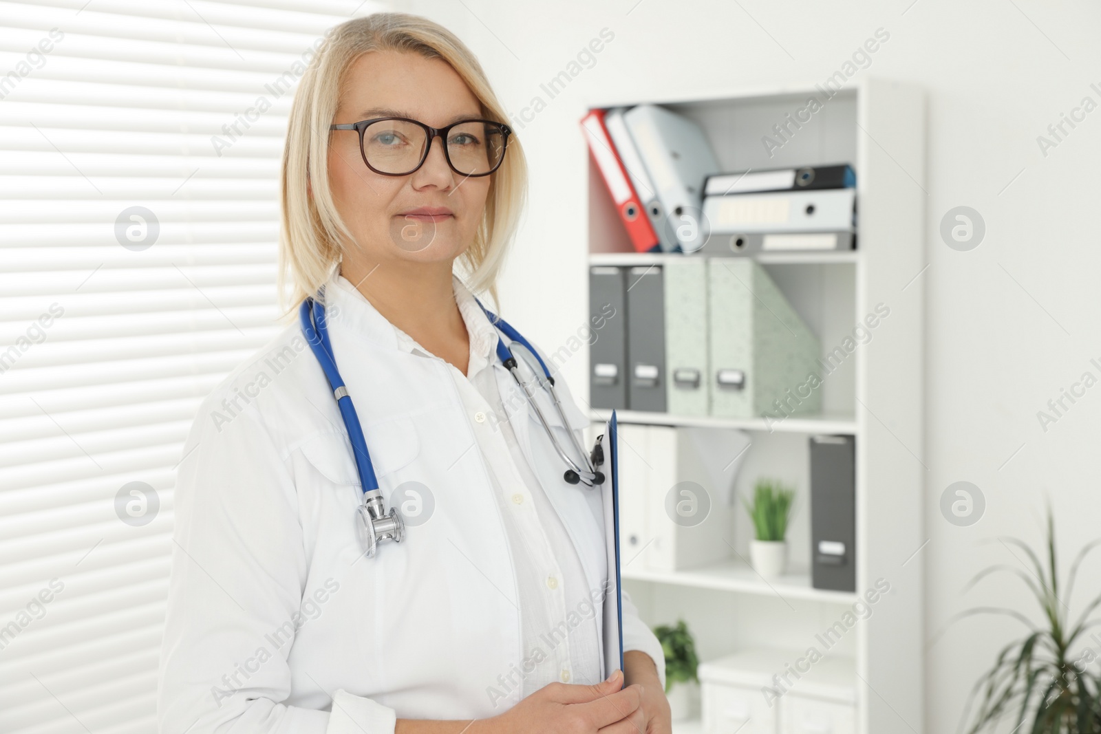 Photo of Professional doctor in uniform with stethoscope in clinic