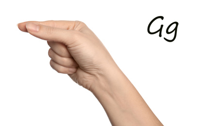 Image of Woman showing letter G on white background, closeup. Sign language