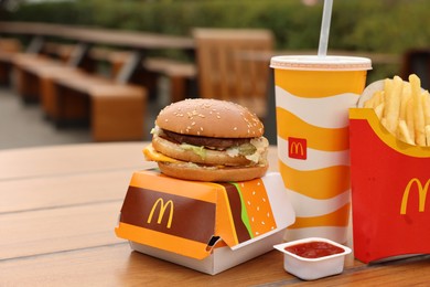 Lviv, Ukraine - October 9, 2023: McDonald's menu on wooden table outdoors, space for text