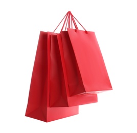 Photo of Red paper shopping bags isolated on white