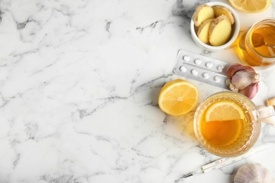 Photo of Flat lay composition with cold remedies on marble table, space for text. Sore throat treatment