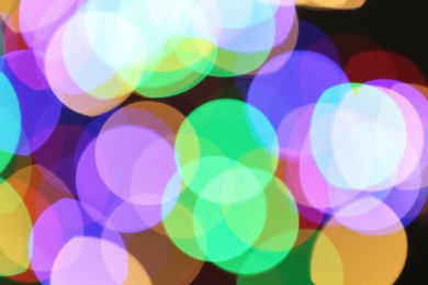 Photo of Beautiful colorful lights on dark background. Bokeh effect