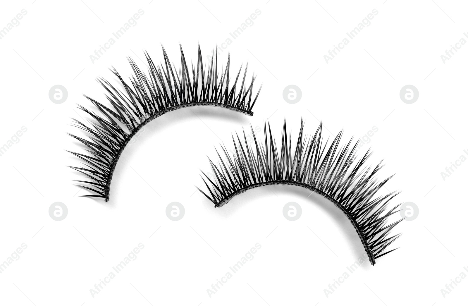 Photo of Beautiful pair of false eyelashes on white background, top view