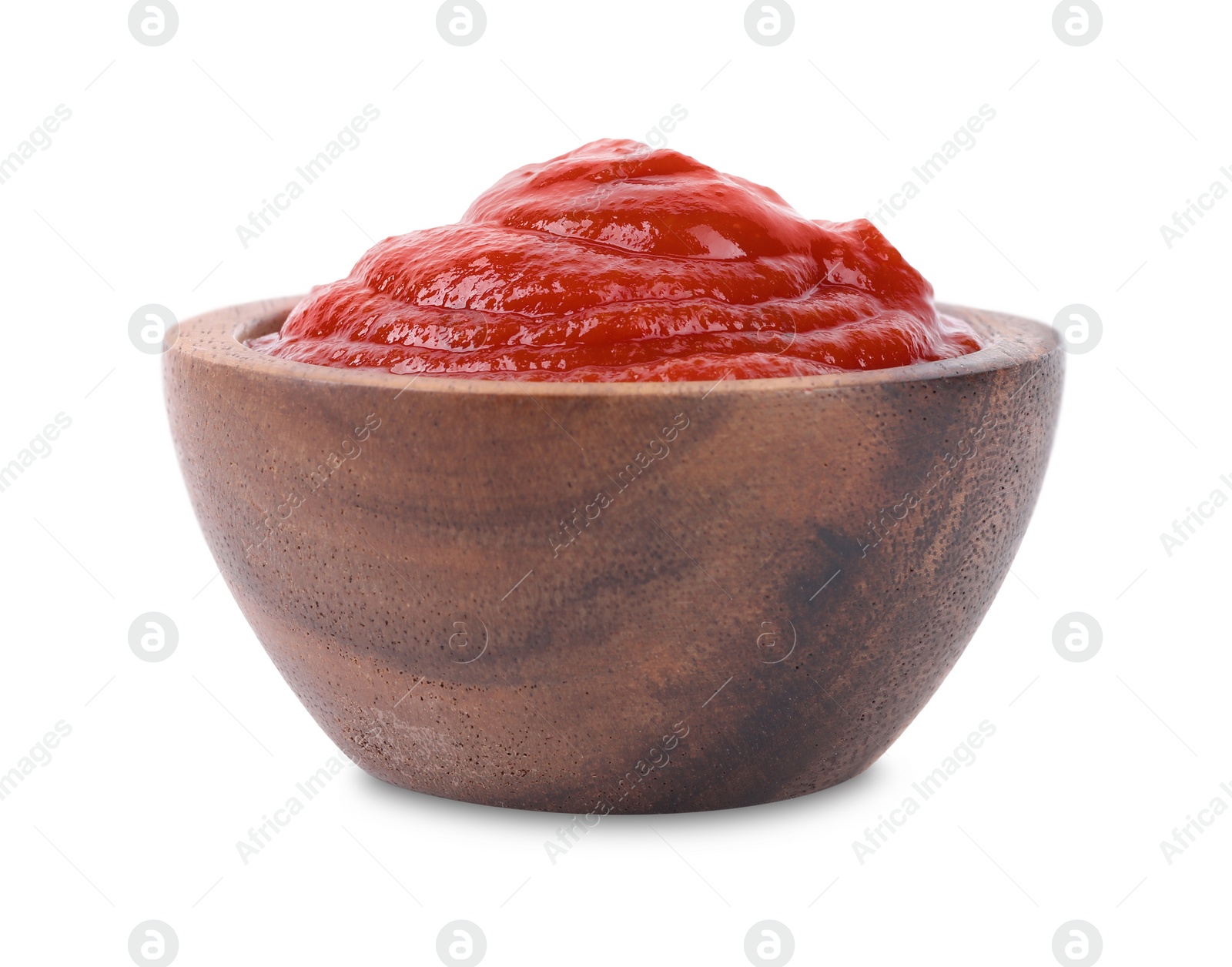 Photo of Organic ketchup in wooden bowl isolated on white. Tomato sauce