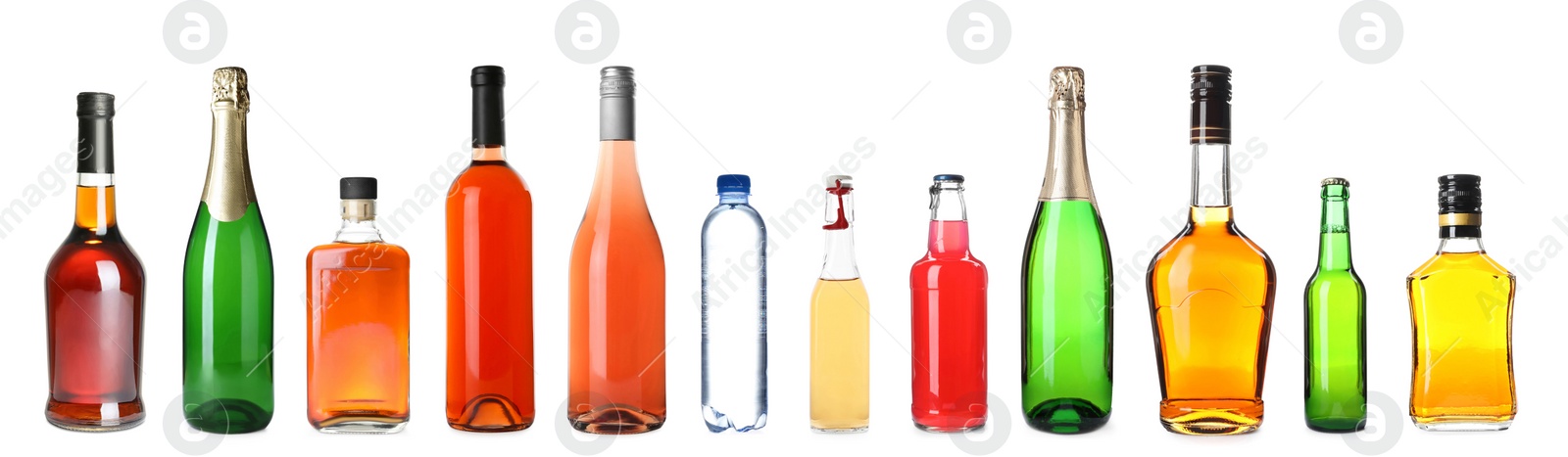 Image of Set of bottles with different liquids on white background. Banner design