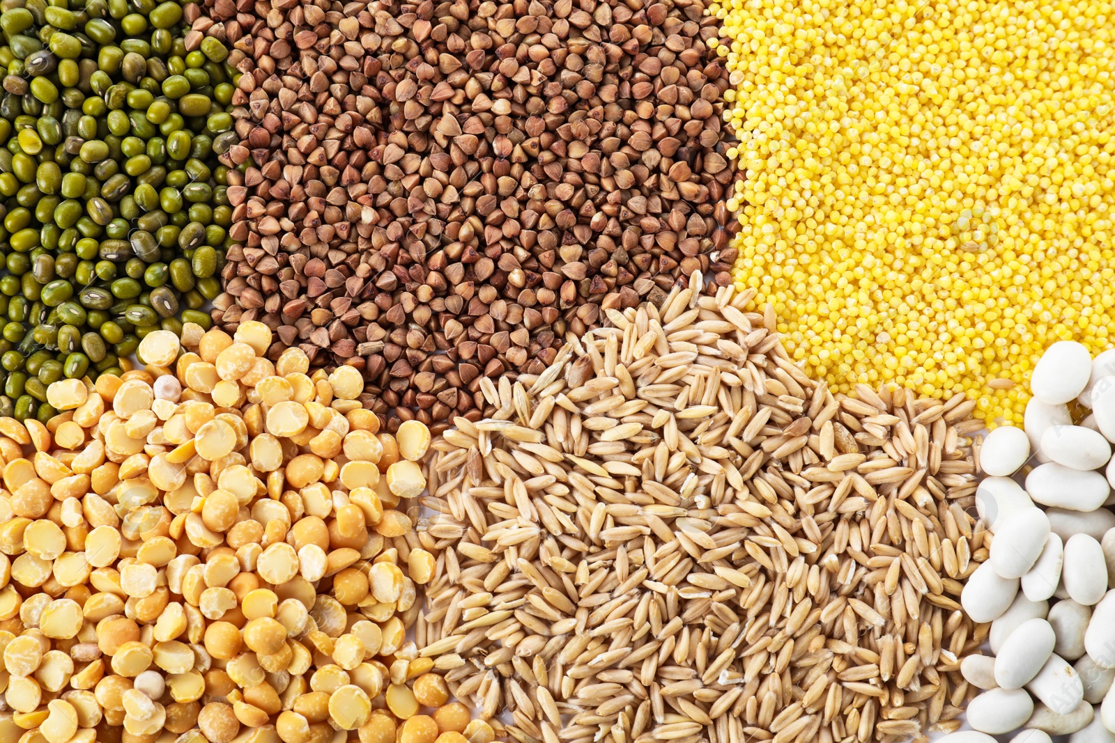 Photo of Different grains and cereals as background, top view