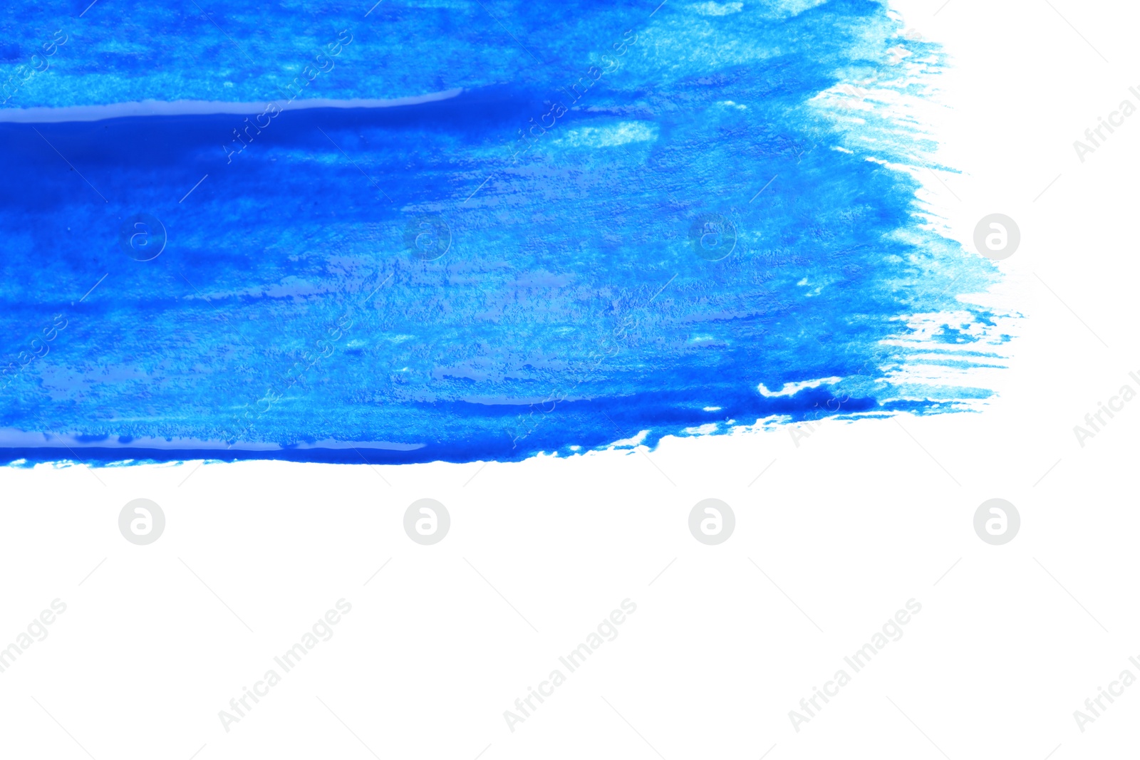 Photo of Abstract brushstroke of blue paint isolated on white