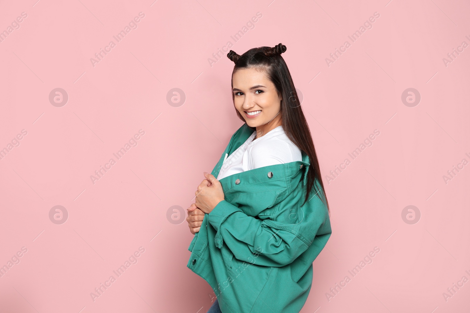 Photo of Portrait of beautiful young woman in stylish clothes on color background