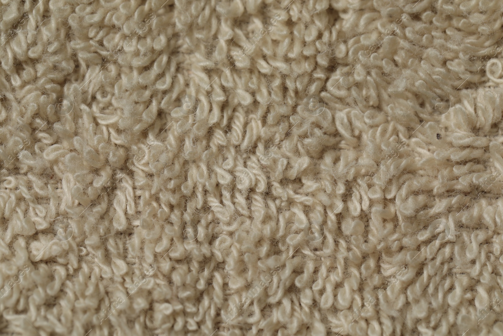 Photo of Texture of soft beige fabric as background, top view