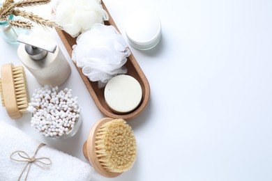 Bath accessories. Flat lay composition with personal care products on white background, space for text