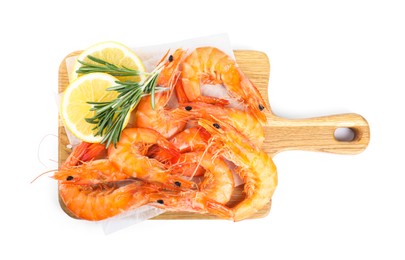 Photo of Delicious cooked shrimps served with lemon and rosemary on white background, top view