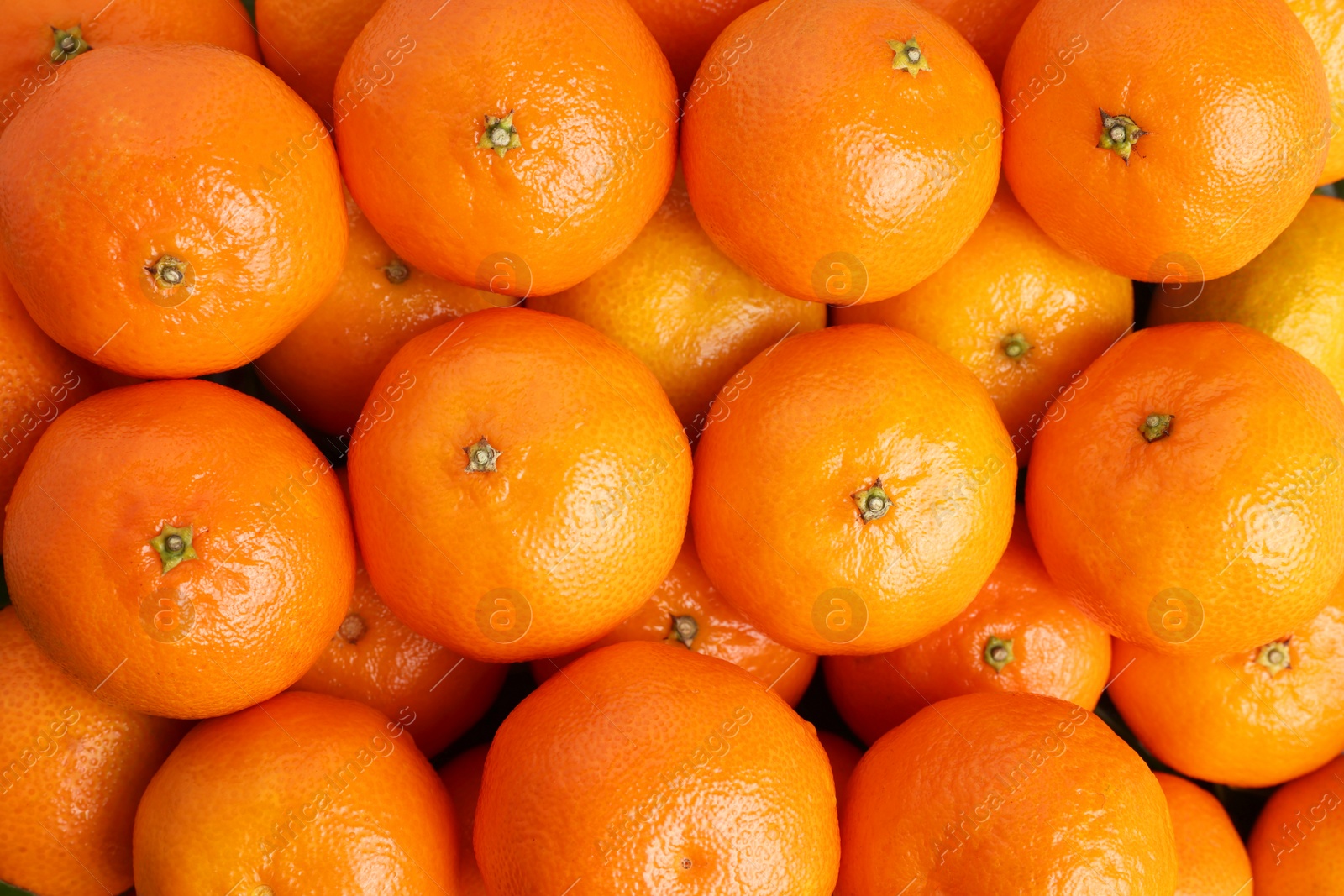 Photo of Delicious fresh tangerines as background, top view