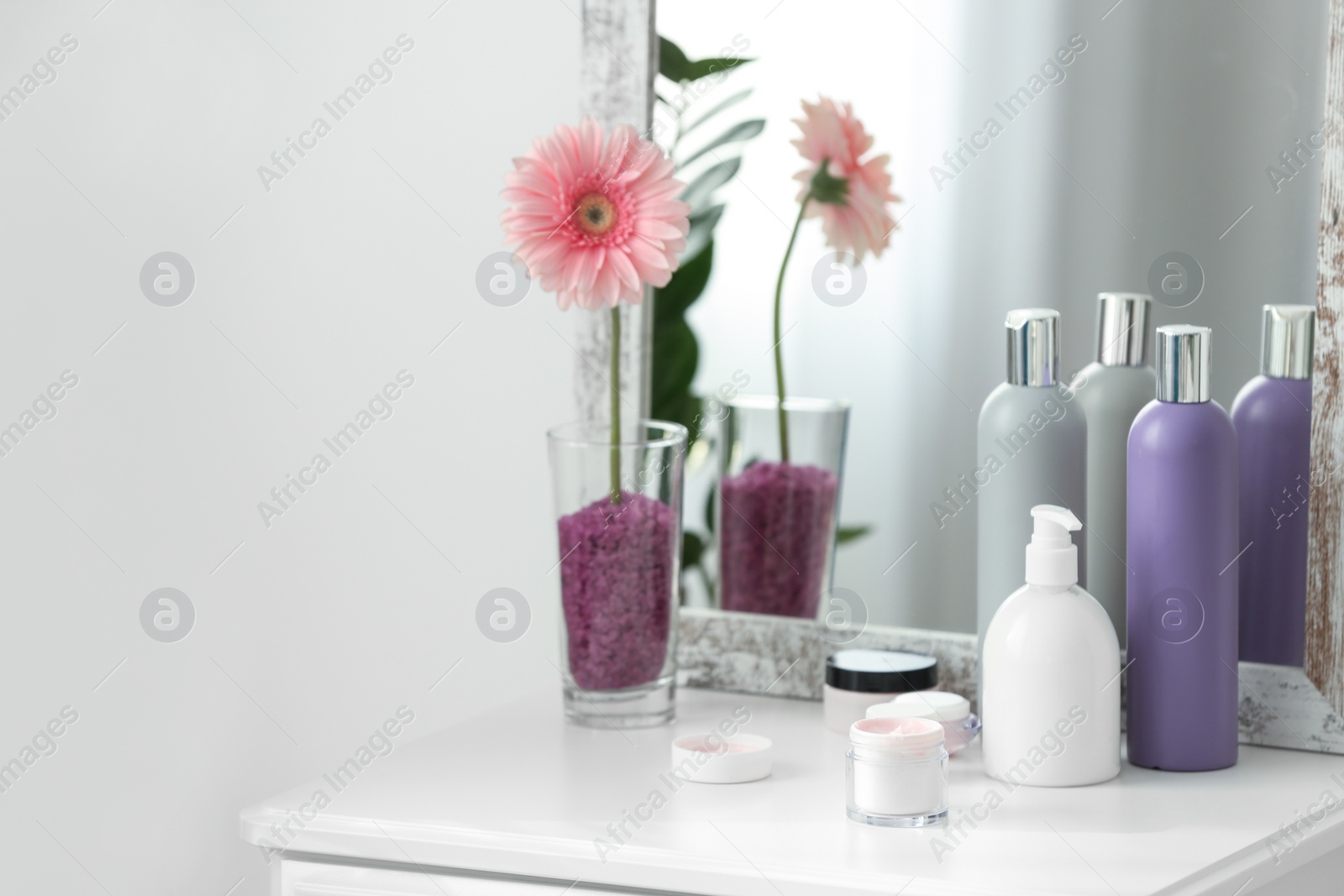 Photo of Set of body care cosmetics on table