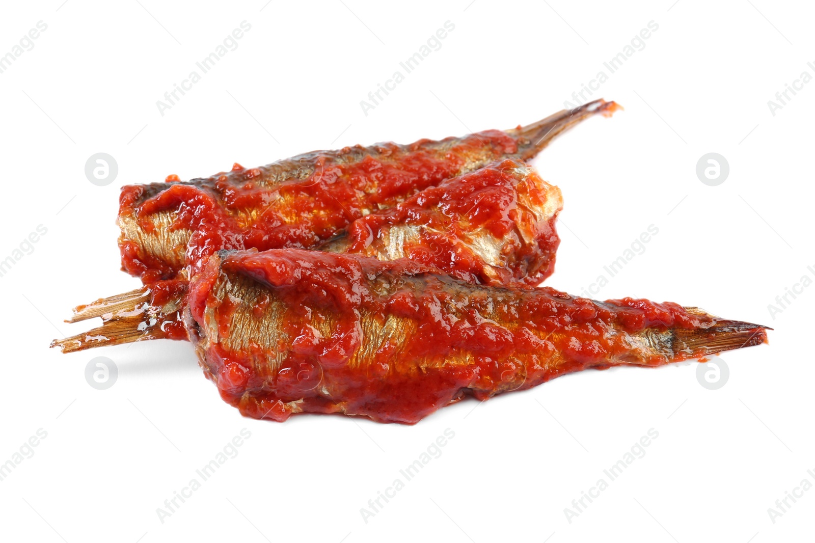 Photo of Tasty canned sprats with tomato sauce isolated on white