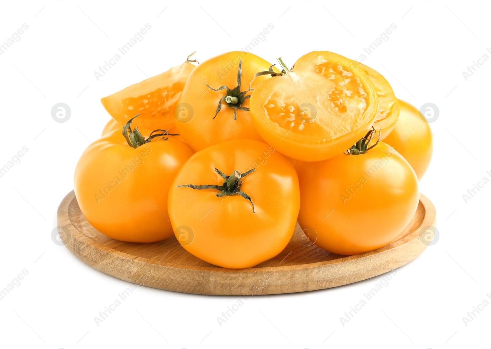 Photo of Wooden plate of fresh ripe yellow tomatoes isolated on white