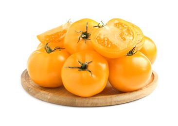 Wooden plate of fresh ripe yellow tomatoes isolated on white