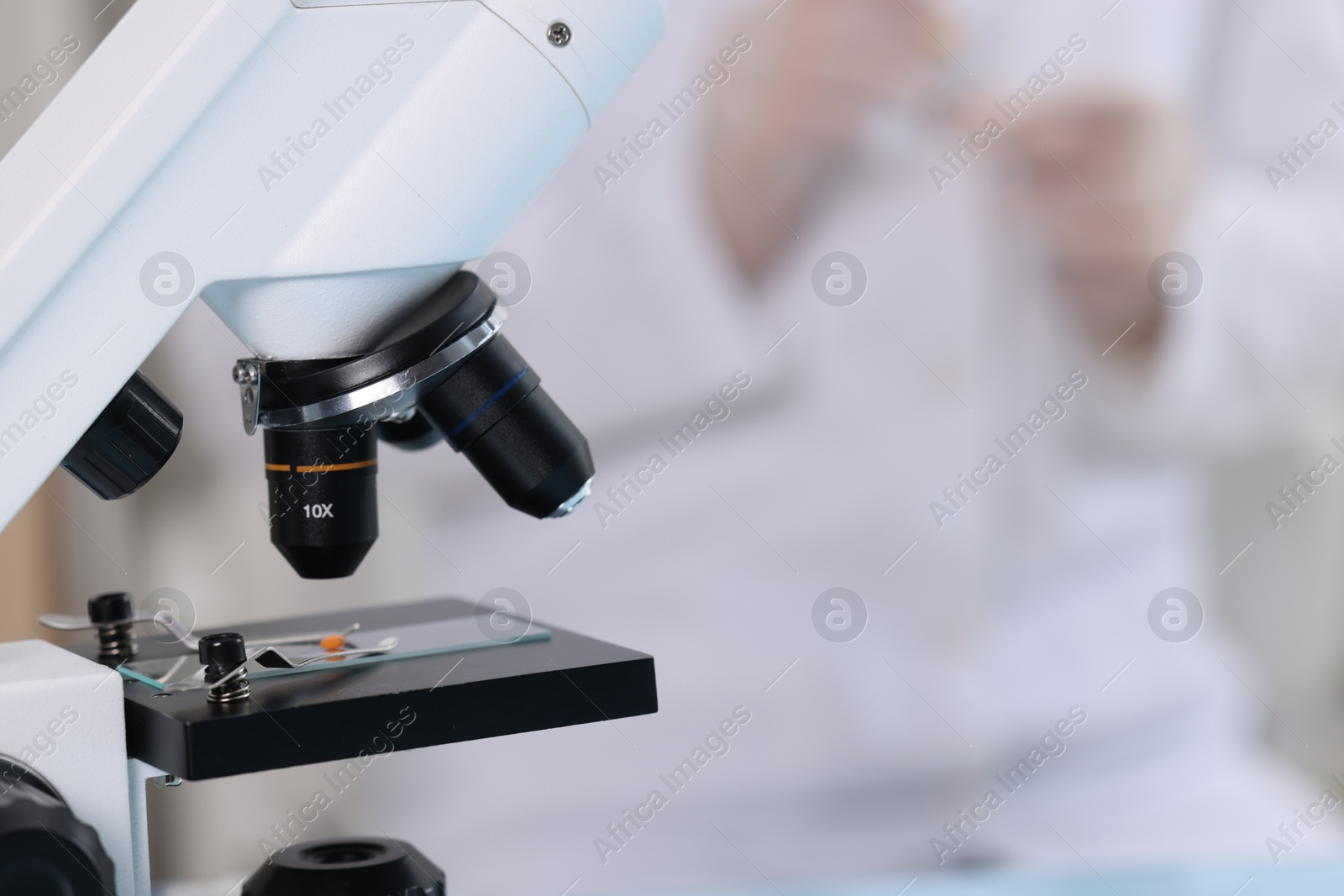 Photo of Quality control. Food inspector working in laboratory, focus on microscope