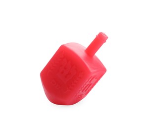 Photo of One red dreidel isolated on white. Traditional Hanukkah game