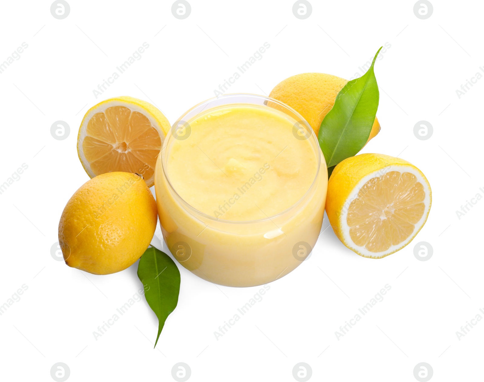 Photo of Delicious lemon curd in glass jar, fresh citrus fruits and green leaves isolated on white