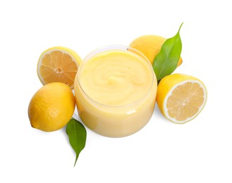 Photo of Delicious lemon curd in glass jar, fresh citrus fruits and green leaves isolated on white