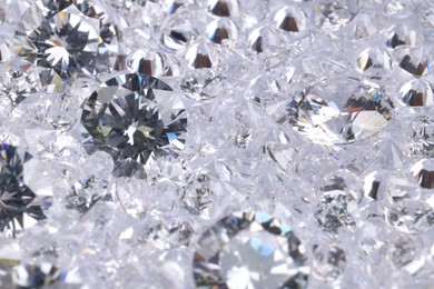 Photo of Many beautiful shiny diamonds as background, closeup