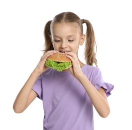 Happy girl eating sandwich on white background. Healthy food for school lunch