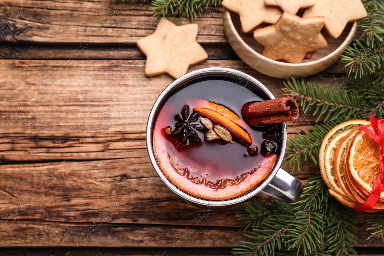 Photo of Flat lay composition with aromatic mulled wine on wooden table, space for text