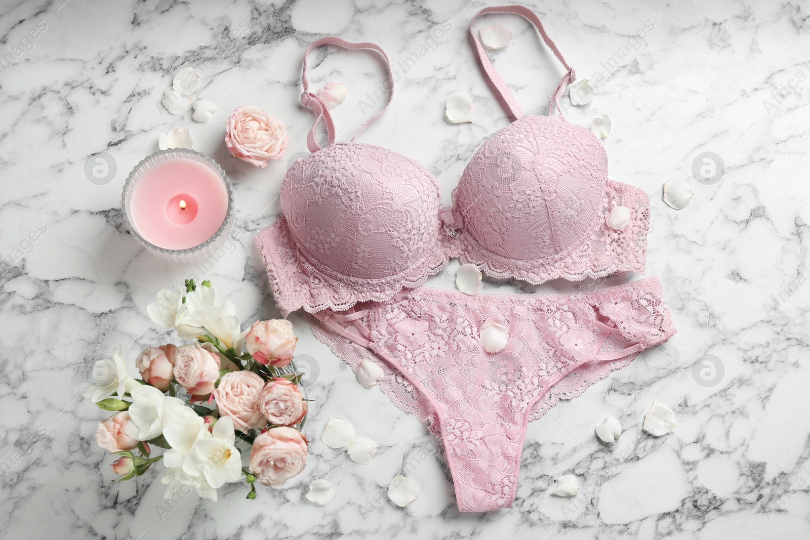 Photo of Flat lay composition with women's underwear on marble background