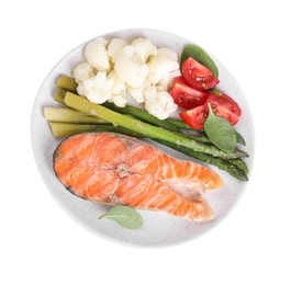 Photo of Healthy meal. Plate with grilled salmon steak and vegetables isolated on white, top view