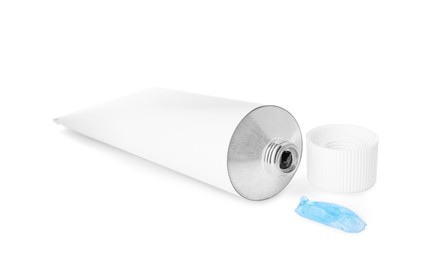 Photo of Open tube with ointment on white background