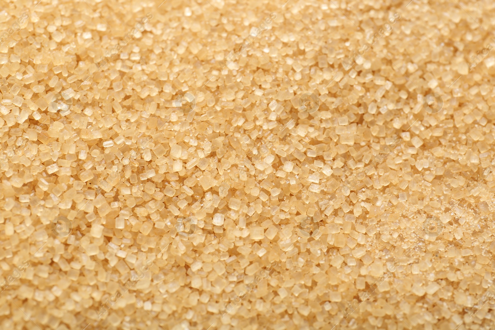 Photo of Granulated brown sugar as background, top view