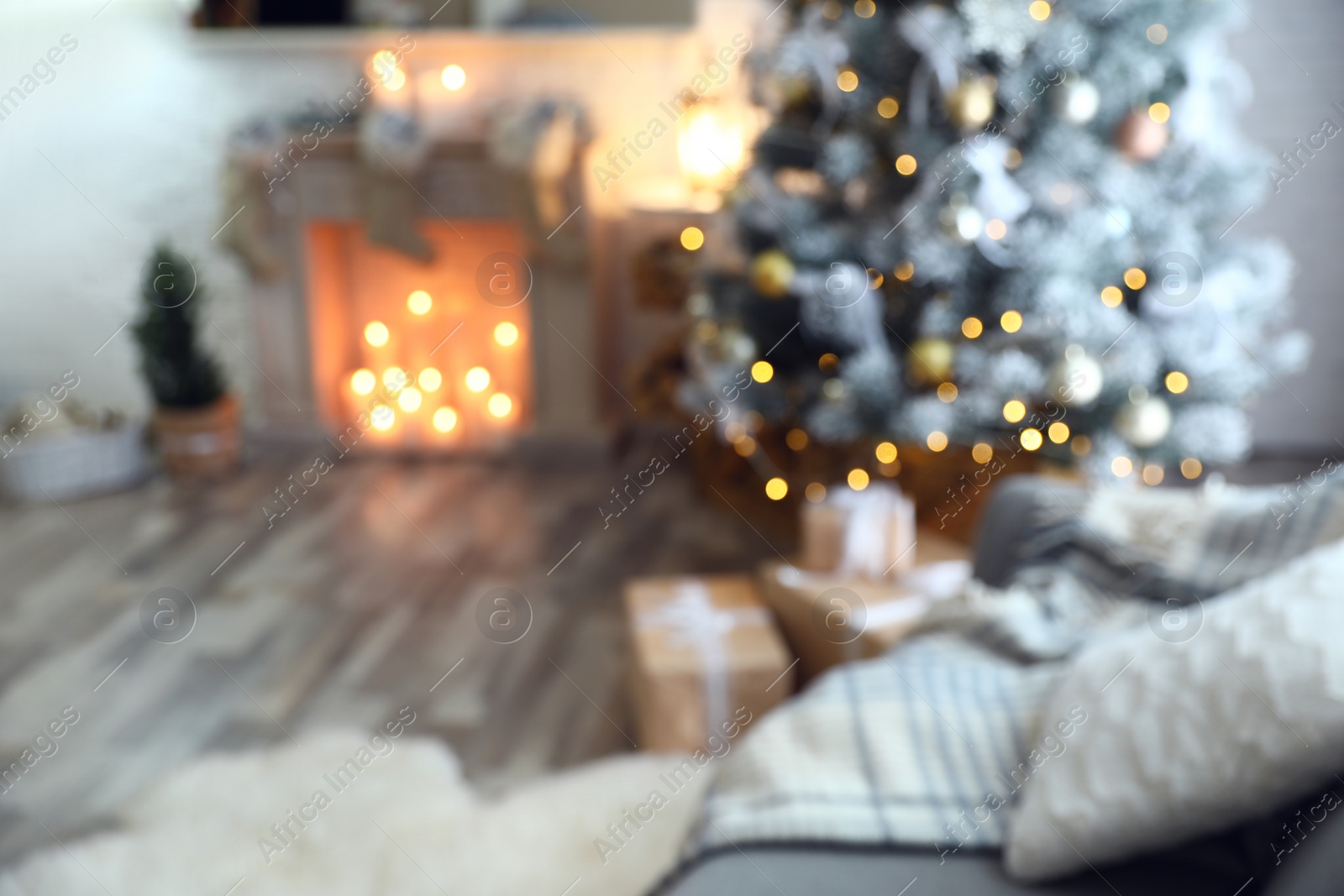 Photo of Blurred view of beautiful Christmas tree in living room interior